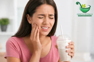 woman experiencing tooth sensitivity pain from cold drink